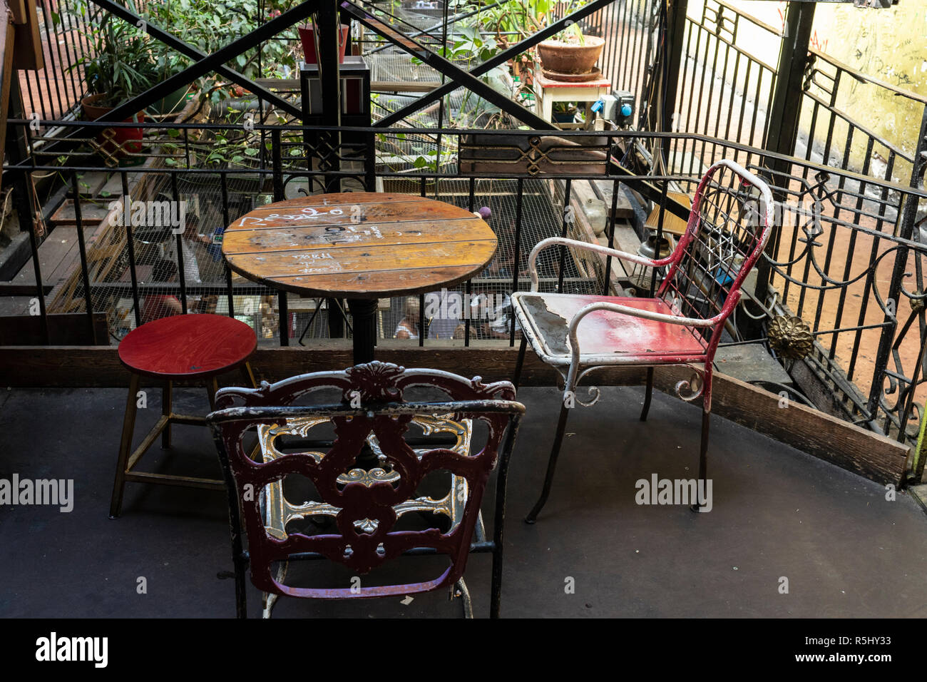 BUDAPEST, HUNGARY - August 12, 2018: Vintage bar furniture on a terrace in Szimpla kert ruin pub, a popular tourist destinations in Hungary. Stock Photo