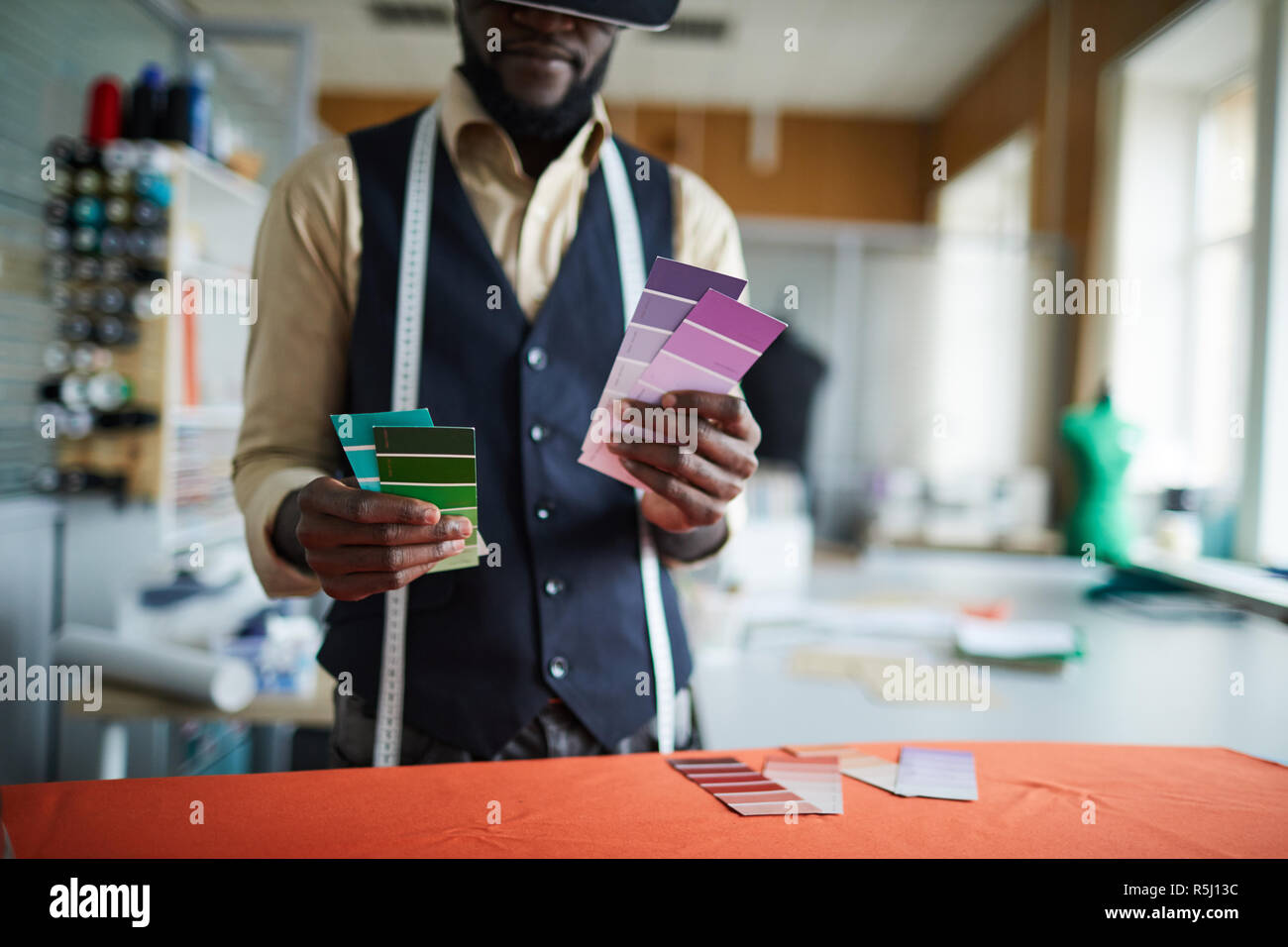 Tailor with palettes Stock Photo