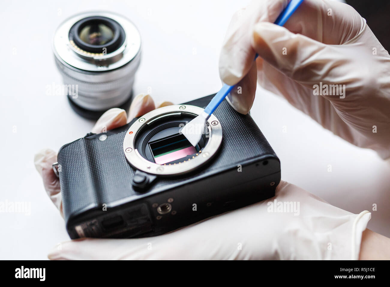 Closeup of mirrorless digital APSC dirty camera matrix sensor