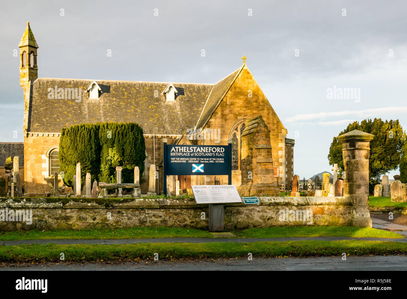 Athelstaneford village Parish Church, National Flag Heritage Centre saltire birthplace churchyard and gravestones, Scotland, UK Stock Photo