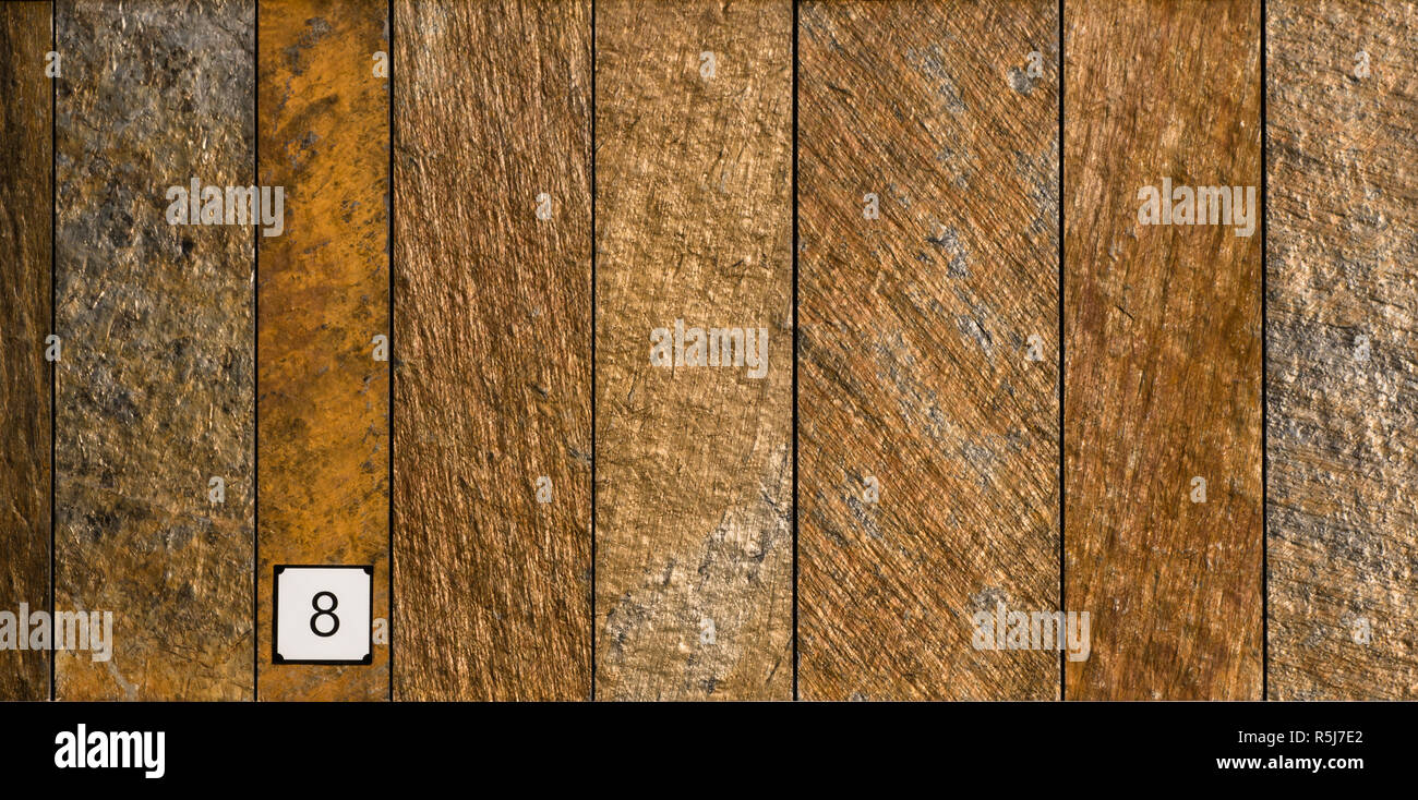 Detail of wall cladding in red iron granite vertical slabs Stock Photo