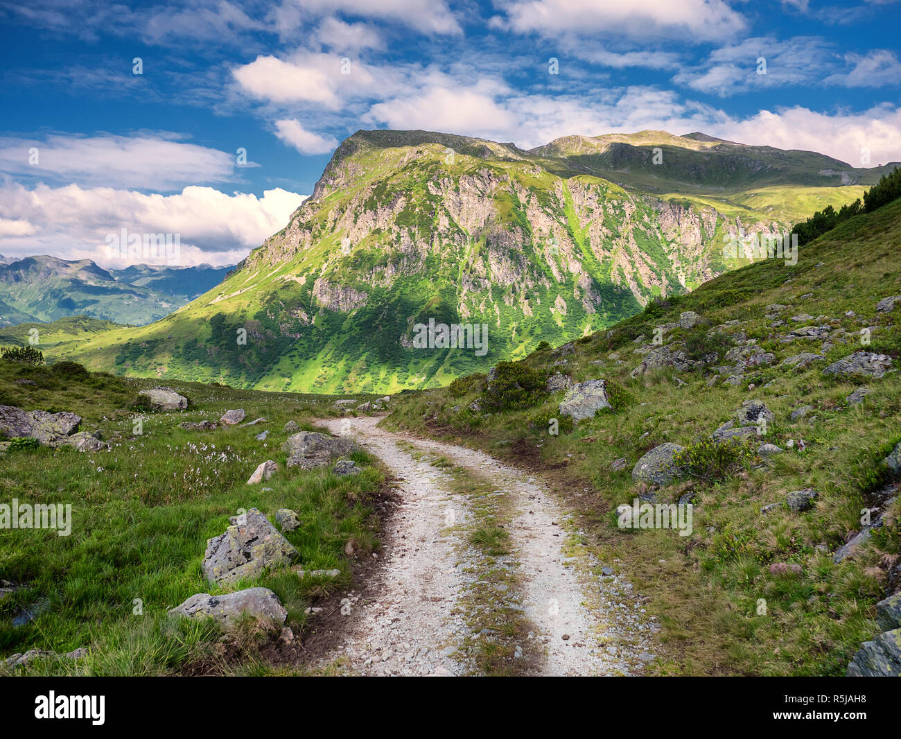 Narrow mountain track leading towards the peak of Versalspitze, Montafon, Vorarlberg, Austria Stock Photo
