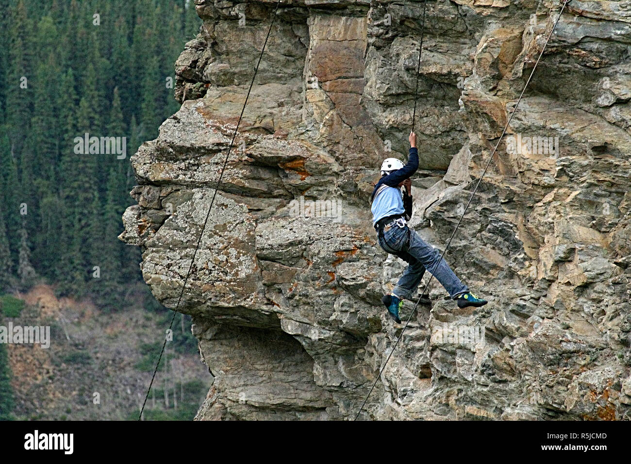 Rock repelling in the Yukon, Canada Stock Photo