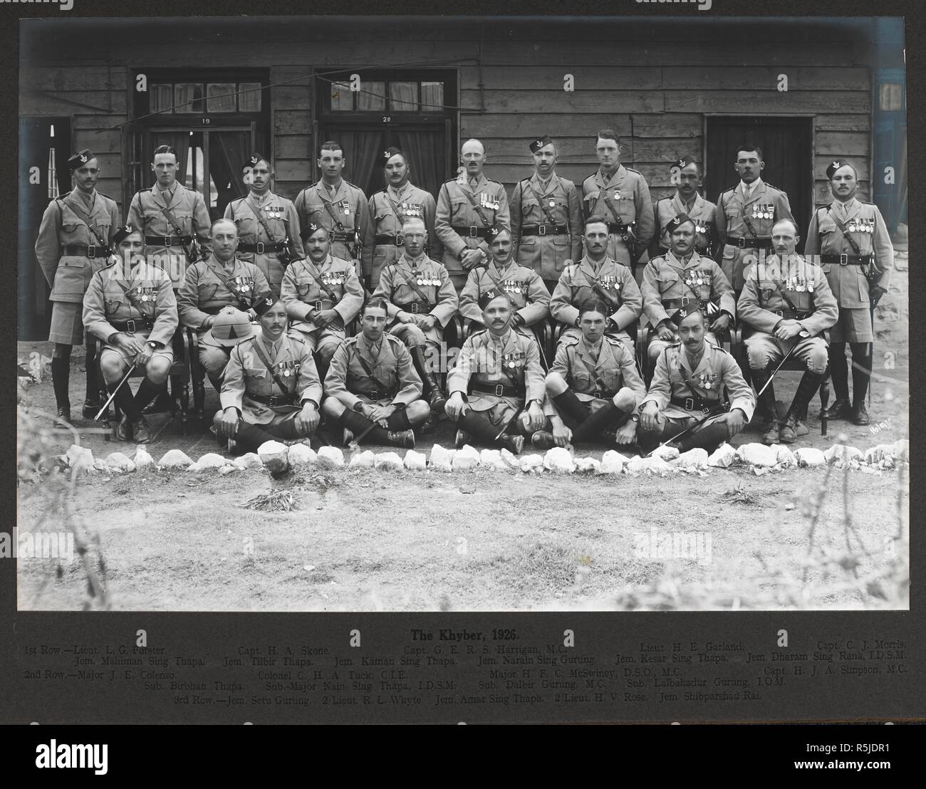 The Khyber, 18 Februrary 1926. Formally posed group of British and Gurkha officers of the 3rd Gurkha Rifles, Identified as follows: (1st row, back): Lieut. L.G. Forster; Capt. H.A. Skone; Capt. G.E.R.S. Hartigan M.C.; Lieut. H.E. Garland; Capt. C.J. Morris; Jem. Mahiman Sing Thapa; Jem. Tilbir Thapa; Jem. Kaman Sing Thapa; Jem. Narain Sing Gurung; Jem. Kasar Sing Thapa; Jem. Dharam Sing Rana I.D.S.M. (2nd row): Major J.E. Colenso; Colonel C.H.A. Tuck C.I.E.; Major H.F.C. McSwiney D.S.O., M.C.; Capt. H.J.A. Simpson M.C.; Sub. Birbhan Thapa; Sub.-Major Nain Sing Thapa I.D.S.M.; Sub. Balbir Gurun Stock Photo