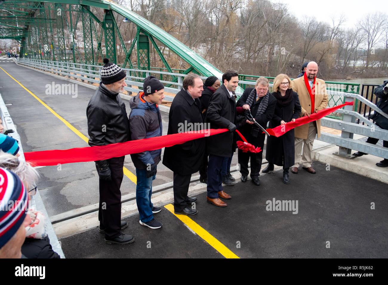 London, Canada, 1st December 2018.  Londoners gather to celebrate the re-opening of their beloved Blackfriars Bridge. Built in 1875, the bridge is reognized a nationally signifcant cultural heritage resource. It is rare example of a wrought iron bowstring arch-truss bridge and the only one of its kind in Canada still used for vehicular traffic. It has been closed for construction since October 2017. Credit: Mark Spowart/Alamy Live News Stock Photo