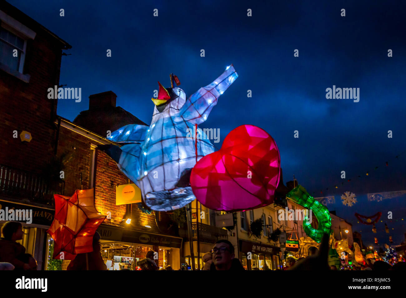 Stony Stratford. North Buckinghamshire, UK.1st December 2018. Lantern Parade with just over 280 lanterns, most of these have been made by families and young children at York House Centre, a Youth, Community and Arts centre over the last few months. The Lantern procession making its way down the packed hight street on it’s way to the Market Square, Credit: Keith J Smith./Alamy Live News Stock Photo