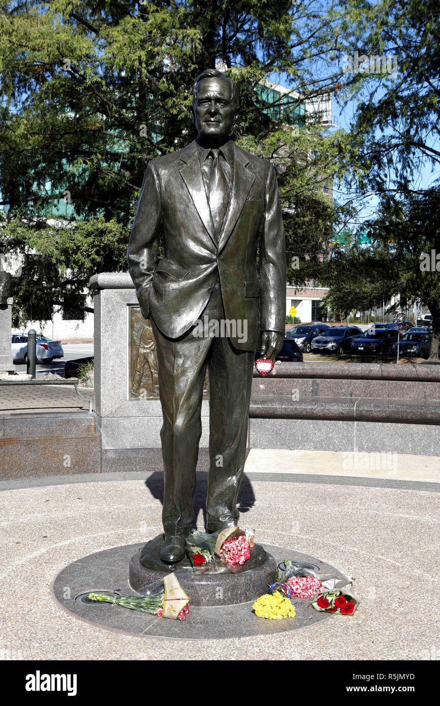 Houston, USA. 1st Dec, 2018. Flowers are seen in front of a statue of former U.S. President George H.W. Bush in Houston, Texas, the United States, on Dec. 1, 2018. George H.W. Bush, the 41st president of the United States, has died Friday at the age of 94, according to a statement from his office. Credit: Steven Song/Xinhua/Alamy Live News Stock Photo