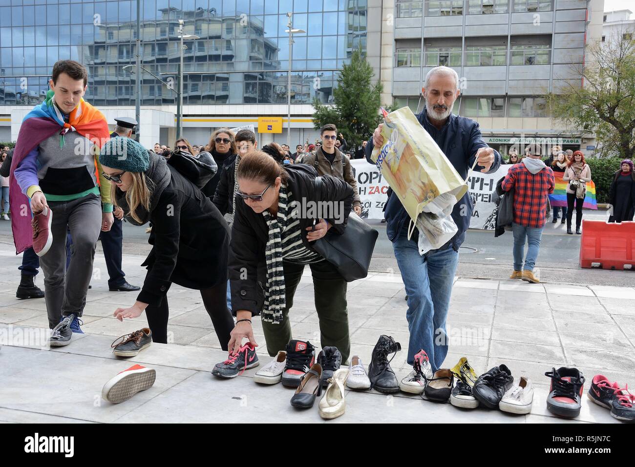 Athens, Greece. 1st Dec, 2018. Protesters are seen leaving their shoes in  front of the General Police Directorate of Attica offices during the  protest.Activists protest in the Memory of Zak Kostopoulos a