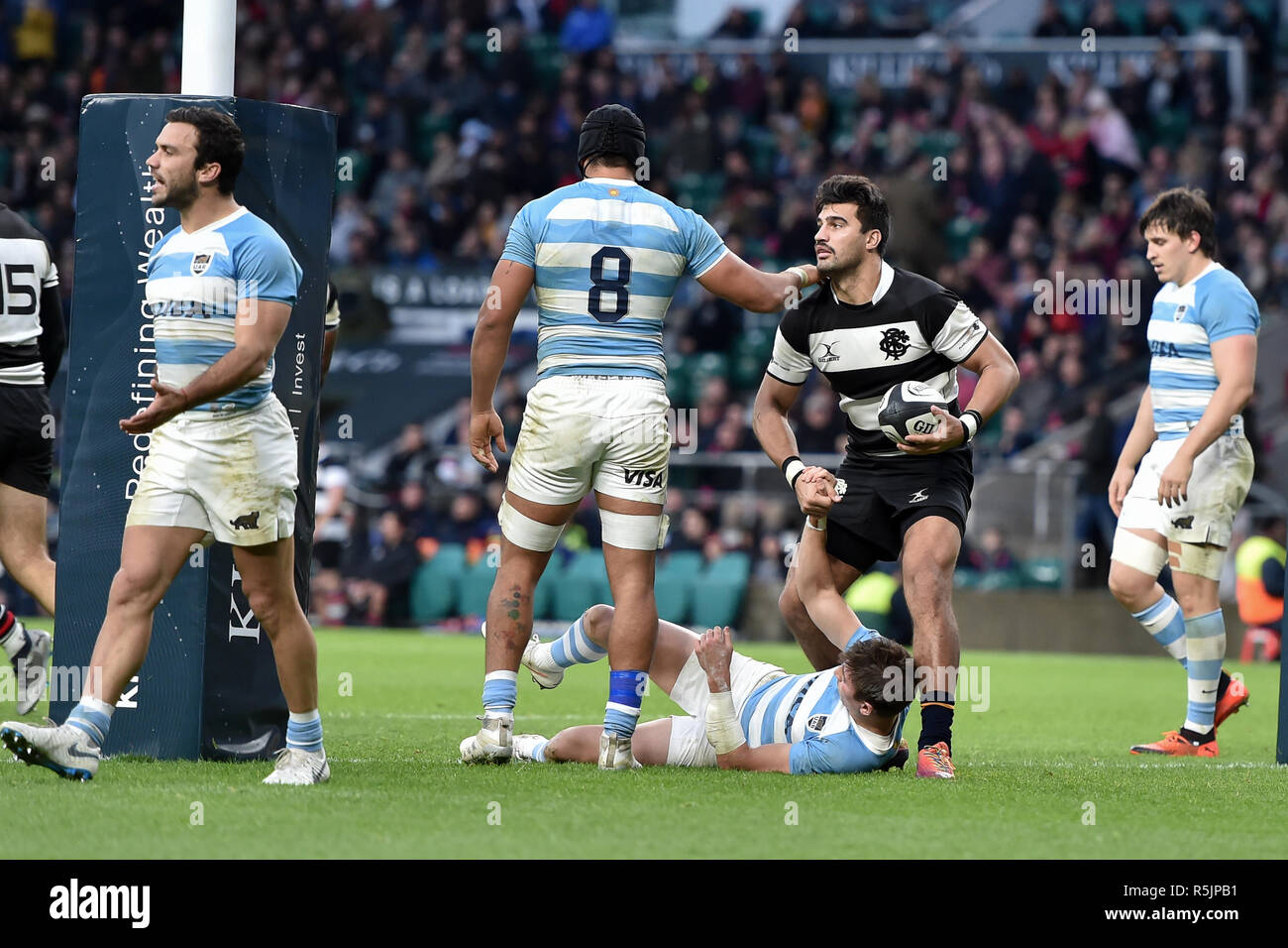 Twickenham, UK. 1st December 2018. Damian de Allende of Barbarians pulled Sebastian Cancelliere of Argentina from ground during The Killik Cup - Barbarians v Argentina at Twickenham Stadium on Saturday, 01 December 2018. LONDON ENGLAND.  (Editorial use only, license required for commercial use. No use in betting, games or a single club/league/player publications.) Credit: Taka G Wu/Alamy News Stock Photo