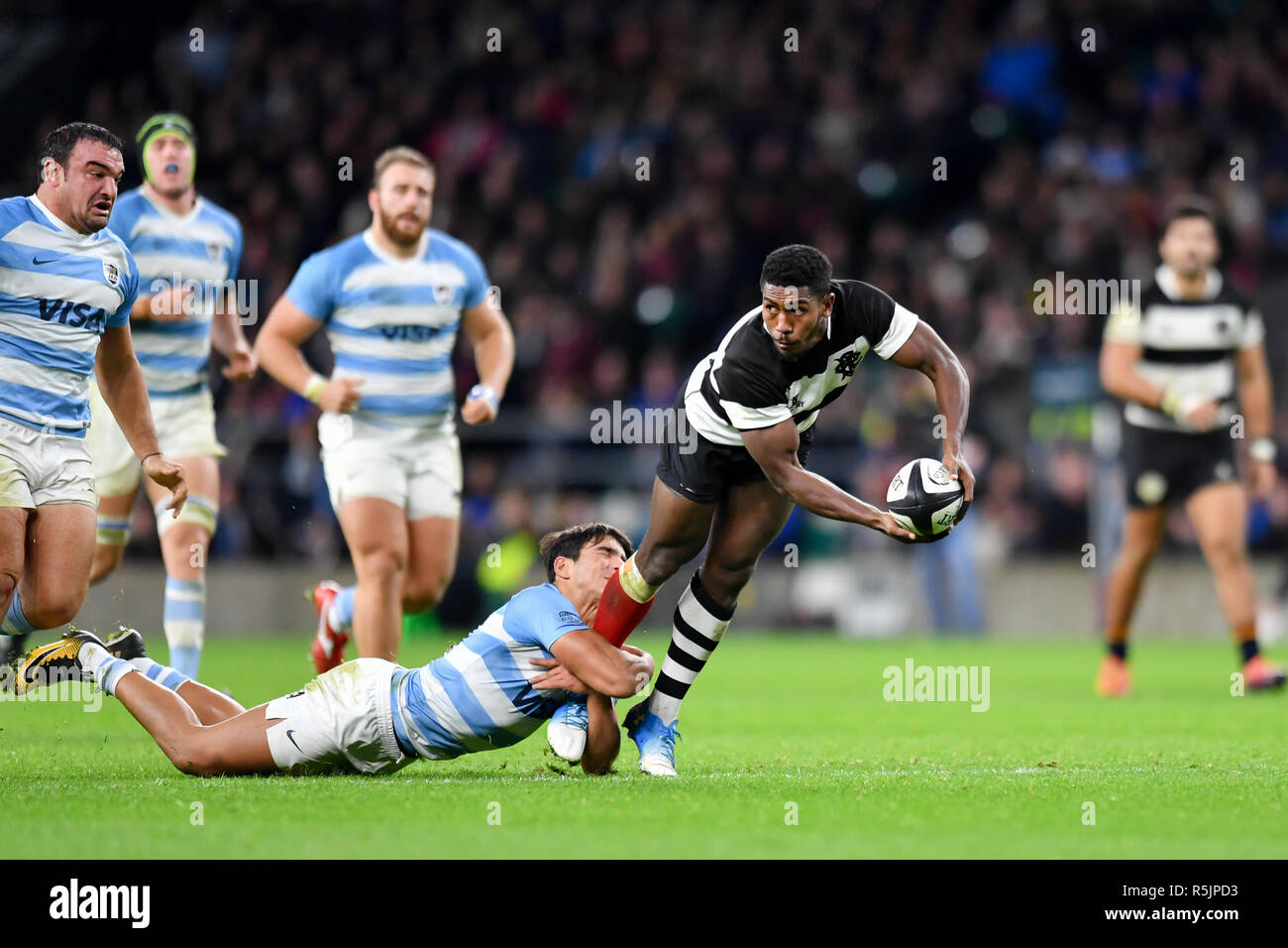 Twickenham, UK. 1st December 2018. Siya Polisi of Barbarians was tackled during The Killik Cup - Barbarians v Argentina at Twickenham Stadium on Saturday, 01 December 2018. LONDON ENGLAND.  (Editorial use only, license required for commercial use. No use in betting, games or a single club/league/player publications.) Credit: Taka G Wu/Alamy News Stock Photo