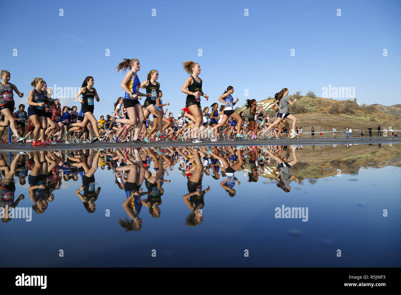 Walnut, CA, USA. 1st Dec, 2018. December 1, 2018 - Walnut, California, USA - High school runners are reflected at the start the Senior Girls Race at the Foot Locker Cross Country Championships West Regional at Mt. San Antonio College in Walnut, CA. Credit: KC Alfred/ZUMA Wire/Alamy Live News Stock Photo