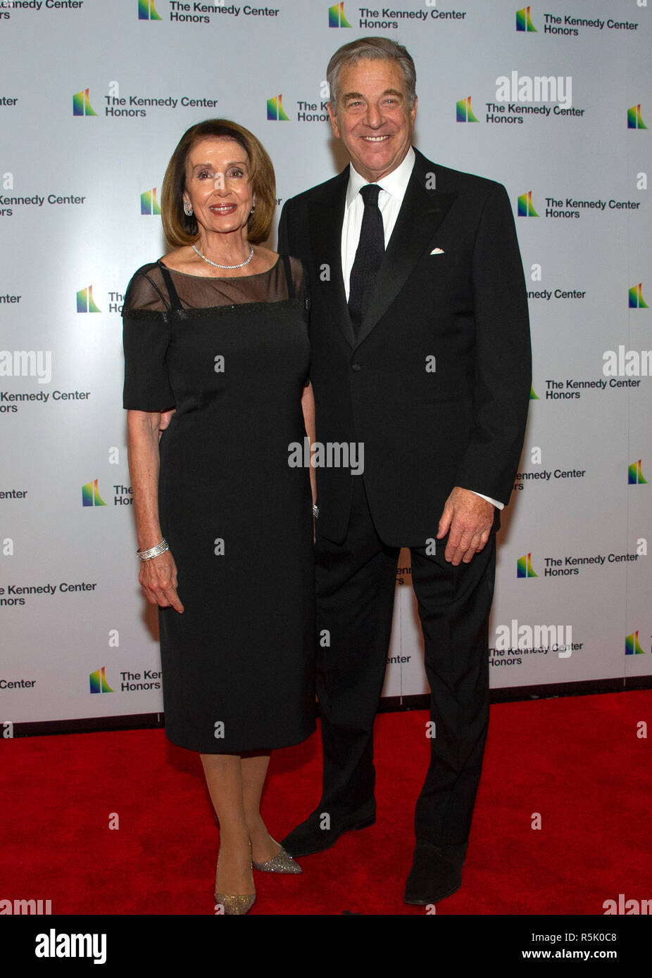 Washington DC, USA. 1st XDecember, 2018. United States House Minority Leader Nancy Pelosi (Democrat of California) and her husband, Paul, arrive for the formal Artist's Dinner honoring the recipients of the 41st Annual Kennedy Center Honors hosted by United States Deputy Secretary of State John J. Sullivan at the US Department of State in Washington, DC on Saturday, December 1, 2018. The 2018 honorees are: singer and actress Cher; composer and pianist Philip Glass; Country music entertainer Reba McEntire; and jazz saxophonist and composer Wayne Shorter. Credit: MediaPunch Inc/Alamy Live News Stock Photo