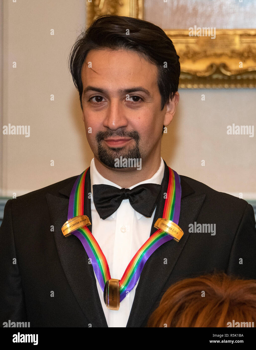 Lin-Manuel Miranda, one of the special honorees for Groundbreaking Work on Hamilton, as he poses with the recipients of the 41st Annual Kennedy Center Honors pose for a group photo following a dinner hosted by United States Deputy Secretary of State John J. Sullivan in their honor at the US Department of State in Washington, DC on Saturday, December 1, 2018. The 2018 honorees are: singer and actress Cher; composer and pianist Philip Glass; Country music entertainer Reba McEntire; and jazz saxophonist and composer Wayne Shorter. This year, the co-creators of Hamilton,- writer and actor Lin-M Stock Photo