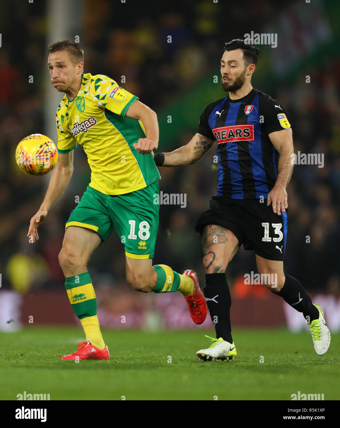 Norwich, UK. 1st December, 2018. Marco Stiepermann of Norwich City bea6s Richie Towell of Rotherham United - Norwich City v Rotherham United, Sky Bet Championship, Carrow Road, Norwich - 1st December 2018  Editorial Use Only - DataCo restrictions apply Credit: MatchDay Images Limited/Alamy Live News Stock Photo