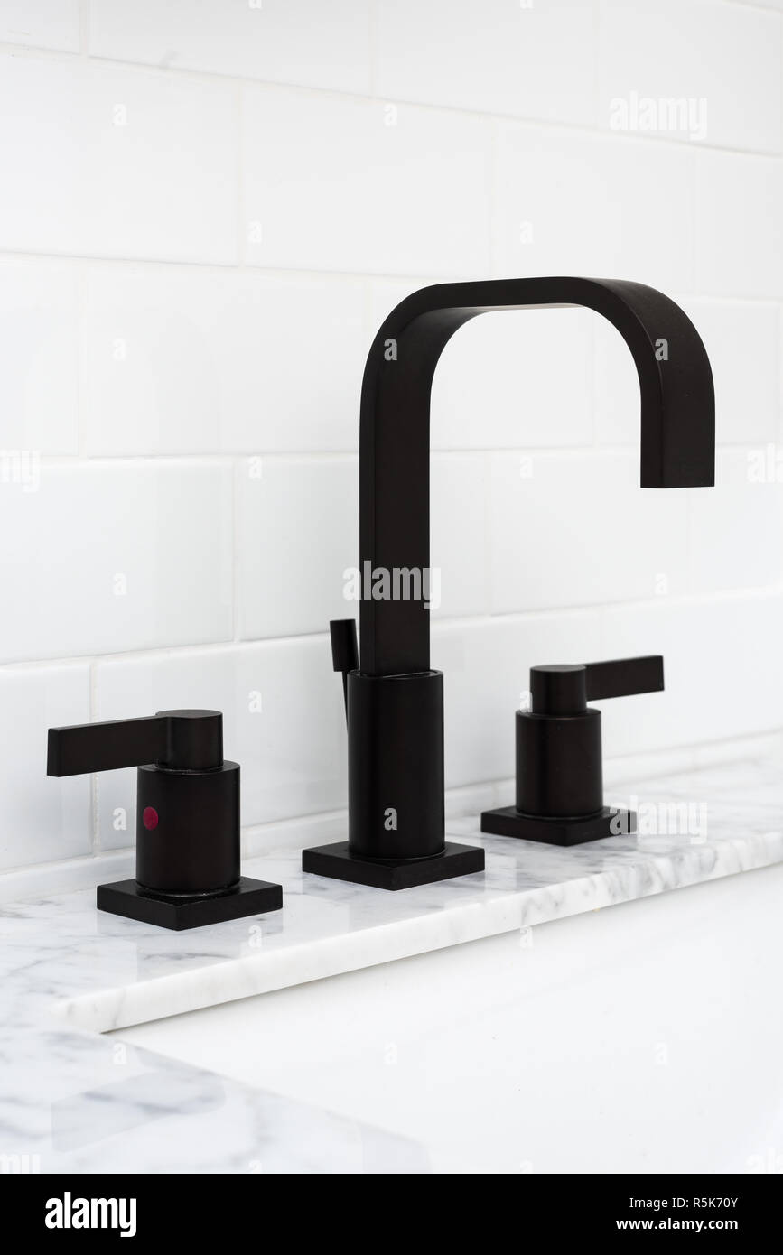 Detail of black sink faucet Stock Photo