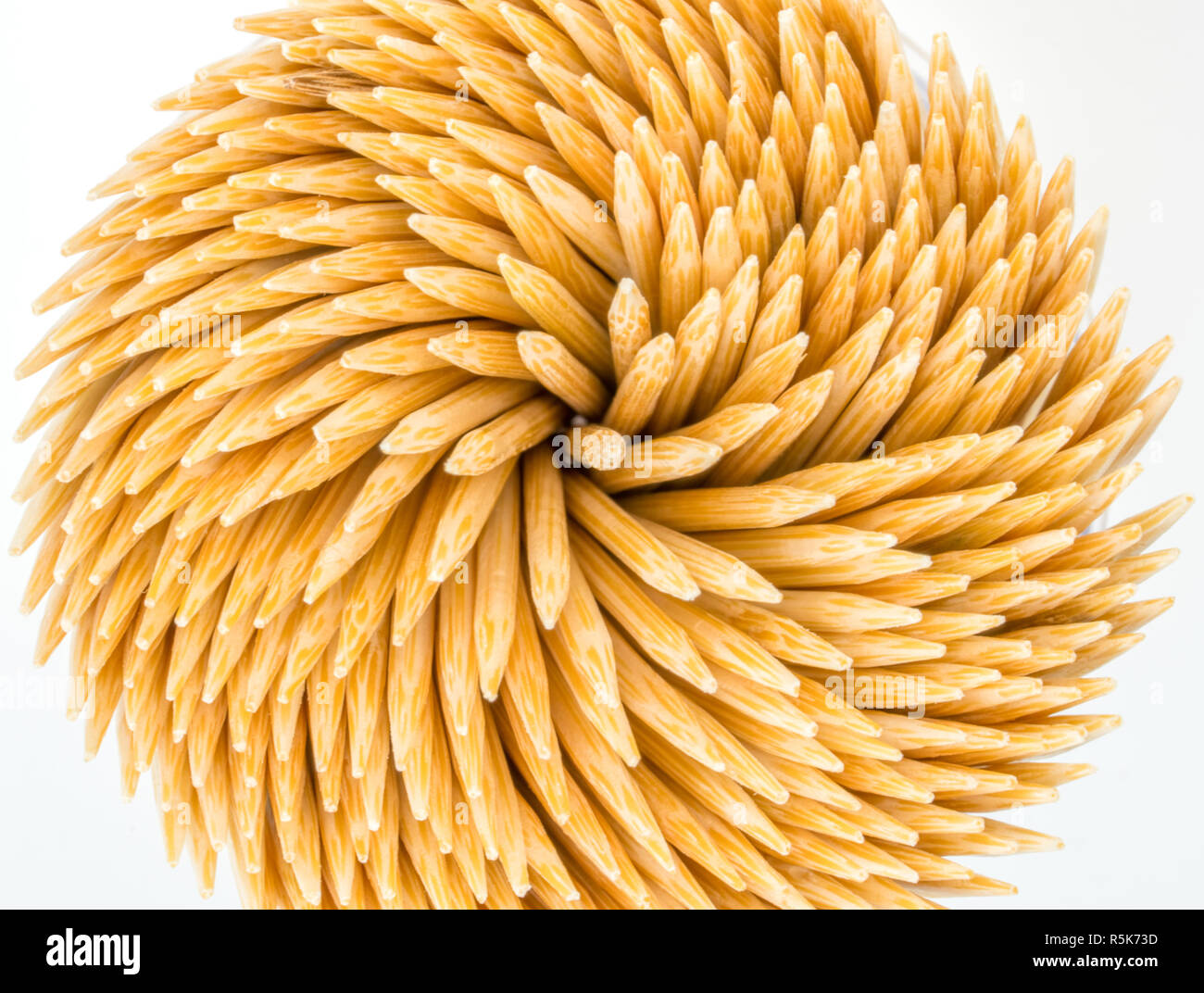 Top view of bamboo toothpicks in round container isolated on white background Stock Photo