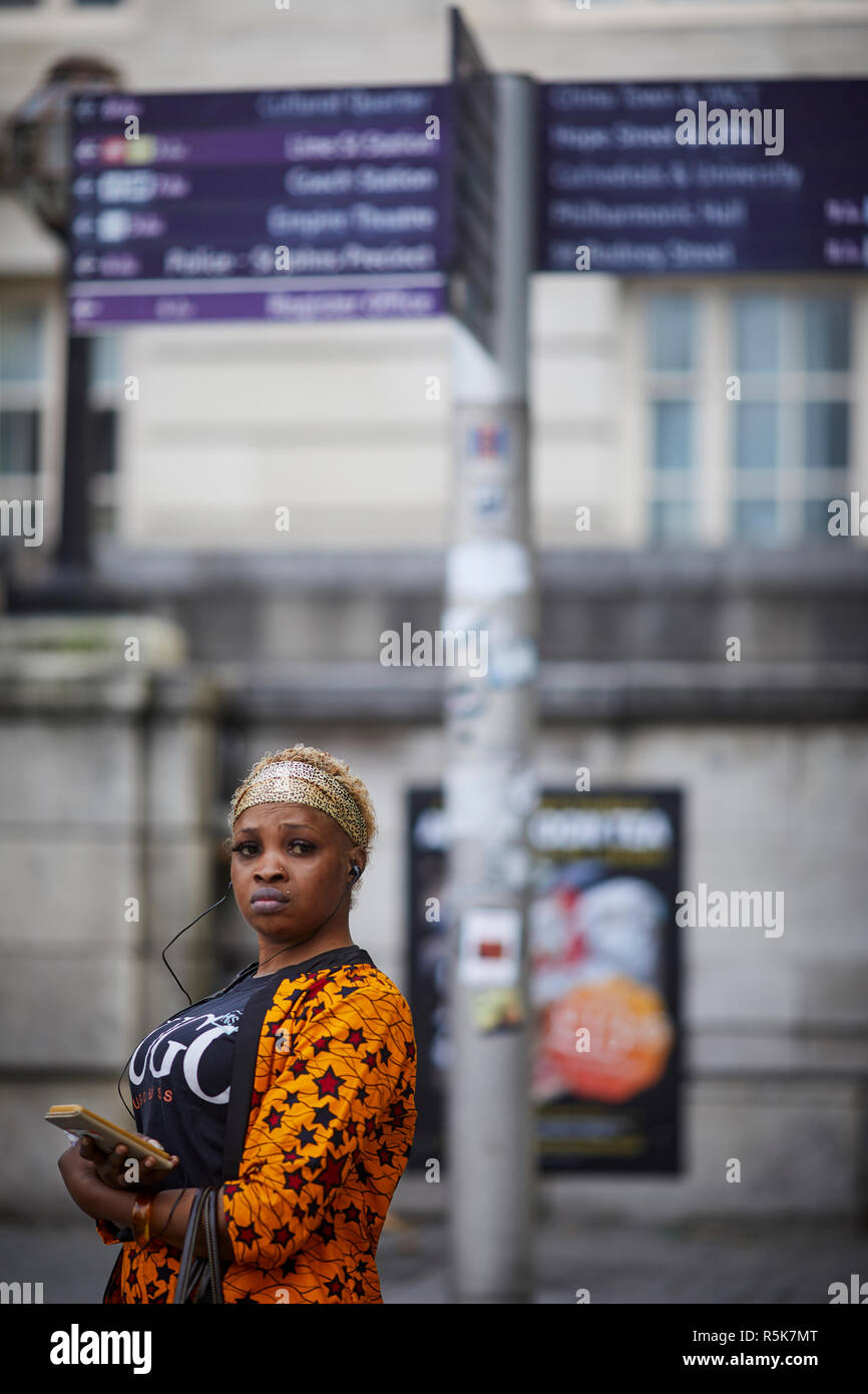 Liverpool city centre  Lady outside Lime Street station Stock Photo