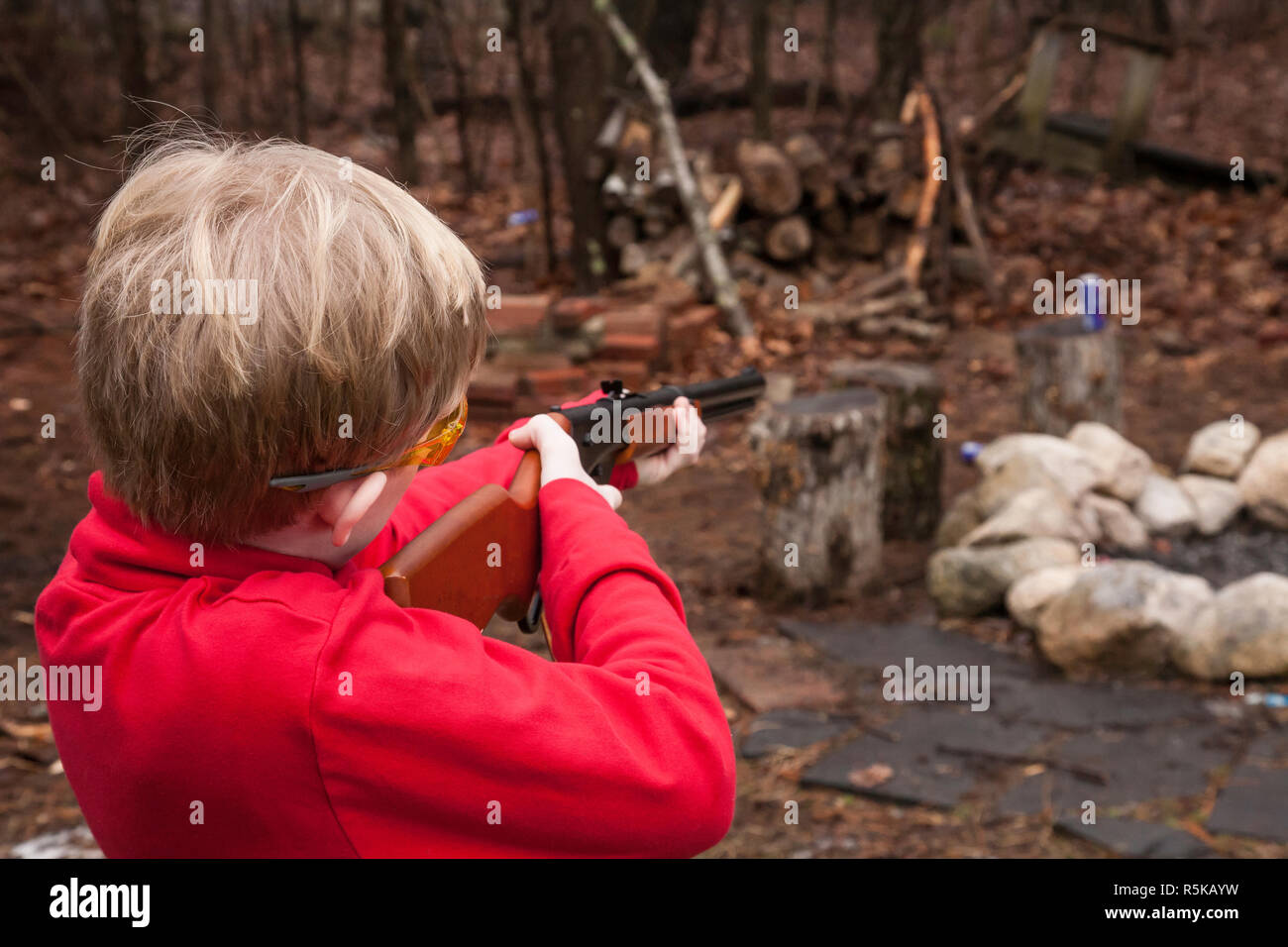 Young boy learning gun safety, USA Stock Photo