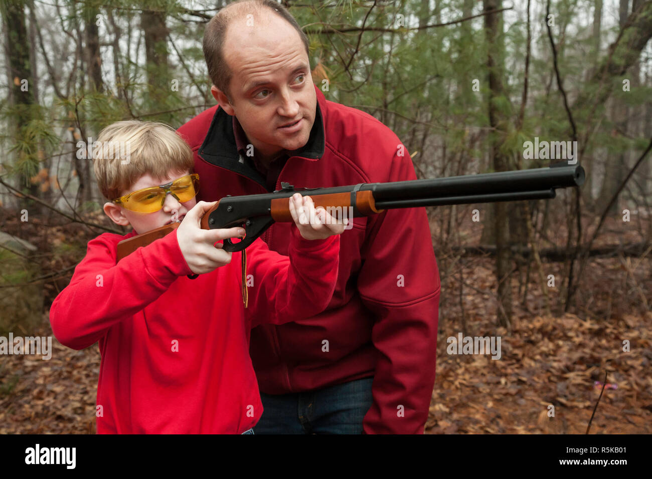 Father teaching son proper gun safety, USA Stock Photo Alamy