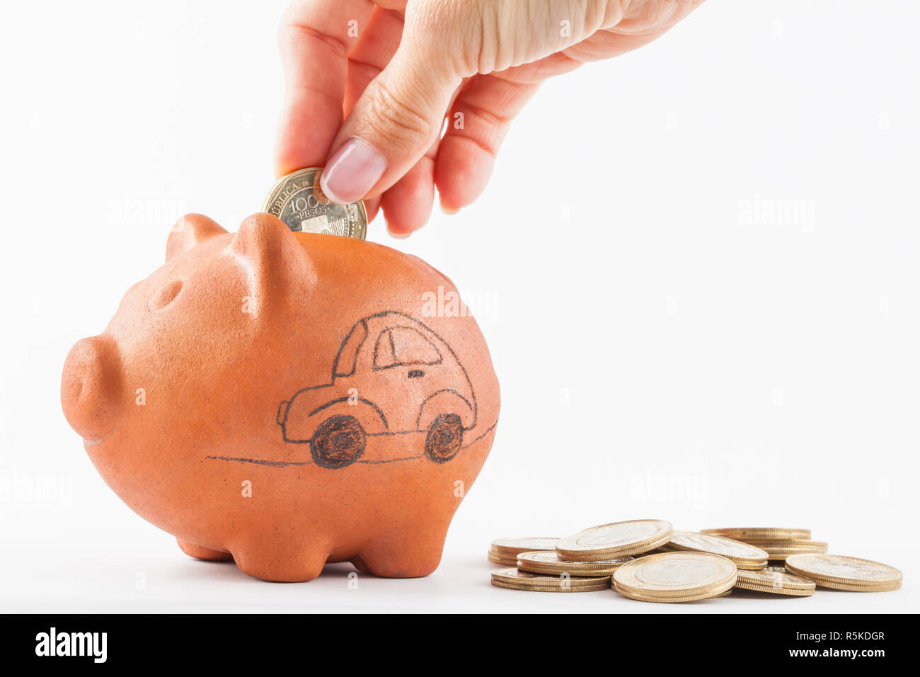Concept Car Clay Stock Photos Concept Car Clay Stock Images Alamy - close up of a woman saving money into a traditional clay piggy bank for a car