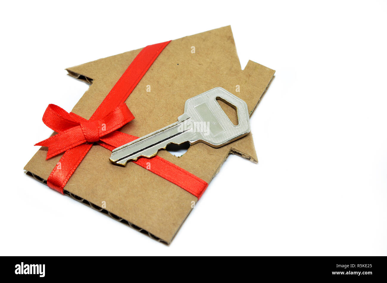 House from cardboard with ribbon Stock Photo - Alamy