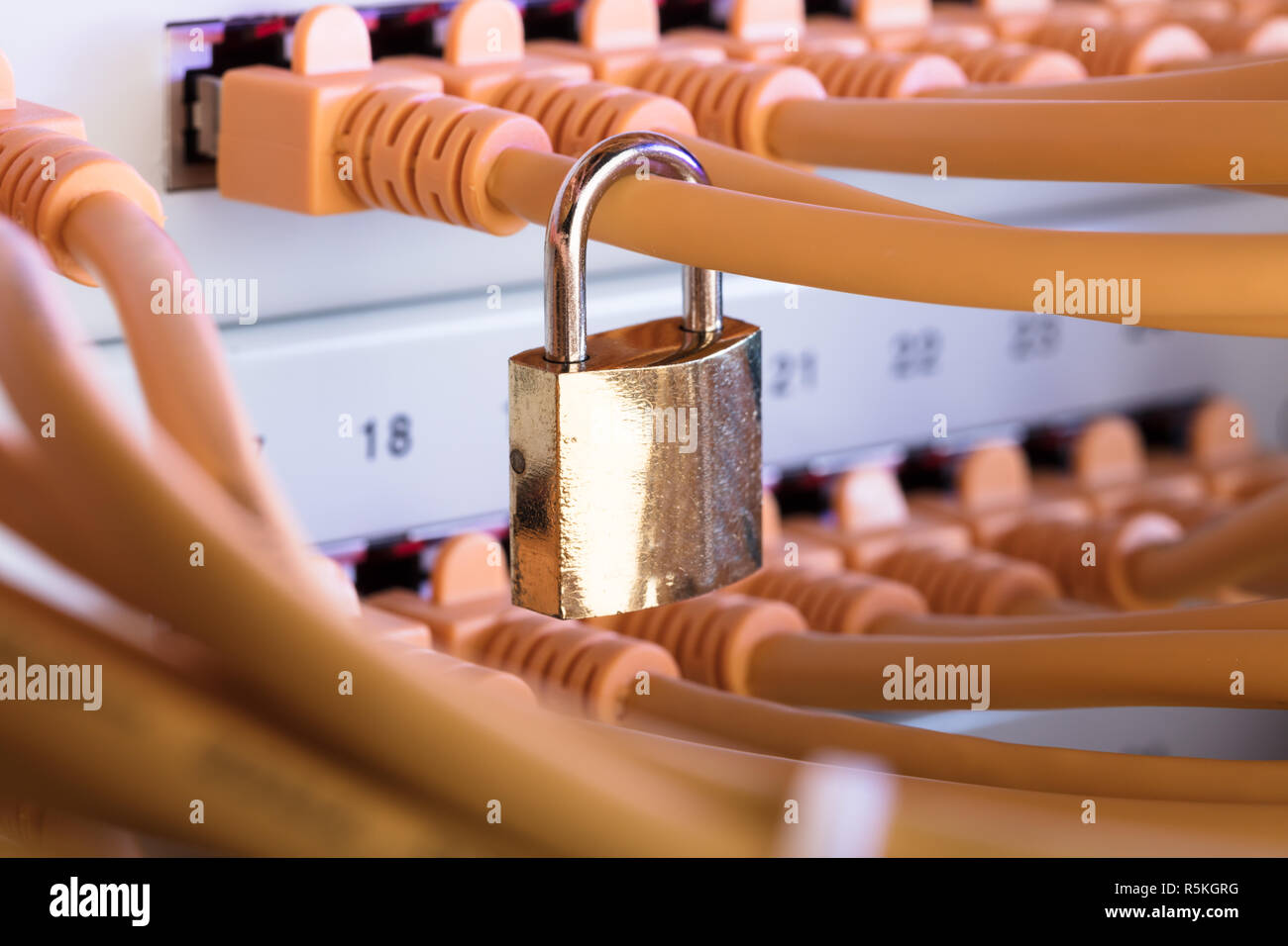 Padlock Attached To Network Cable In Server Room Stock Photo