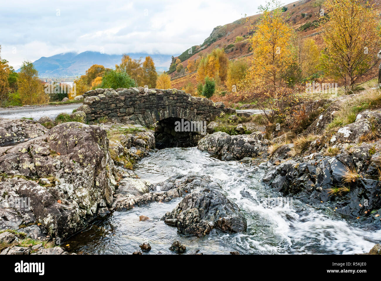 Ashness Bridge. An old pack horse bridge in the English Lakes District close to Derwentwater and the town of Keswick. Stock Photo