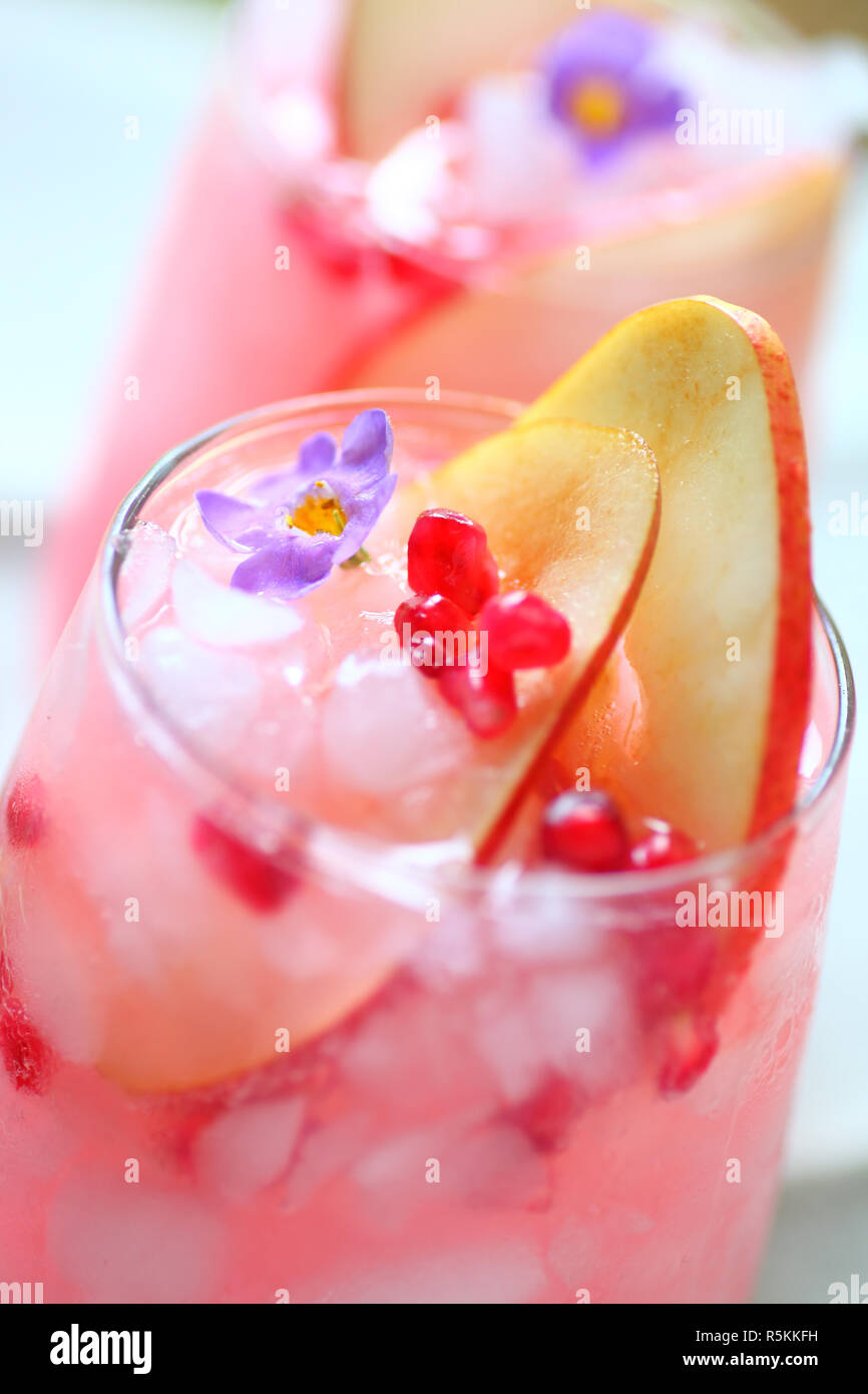 Pink wine cocktail with fruit and flower Stock Photo Alamy
