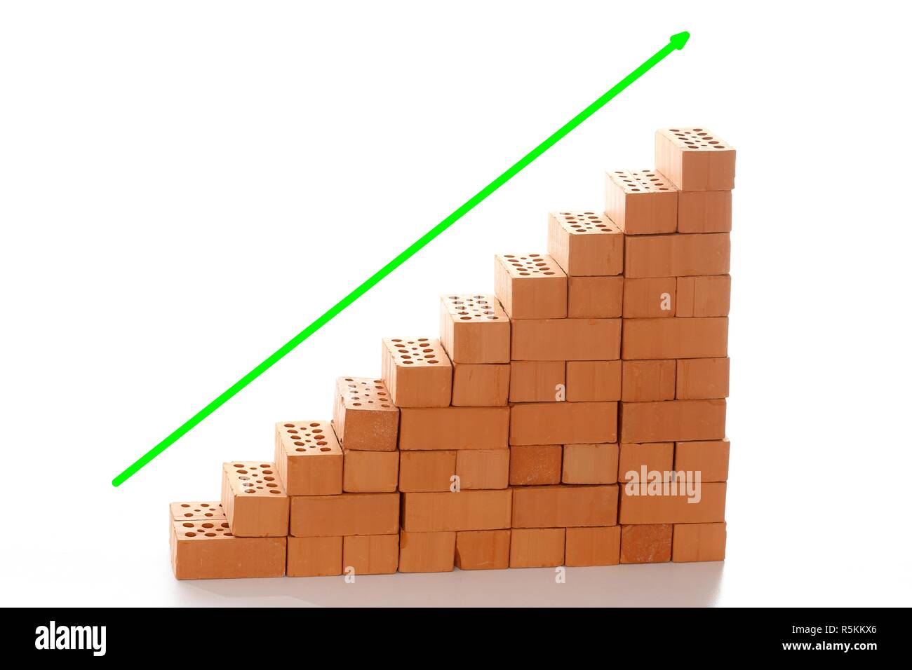 green arrow pointing upwards Stock Photo