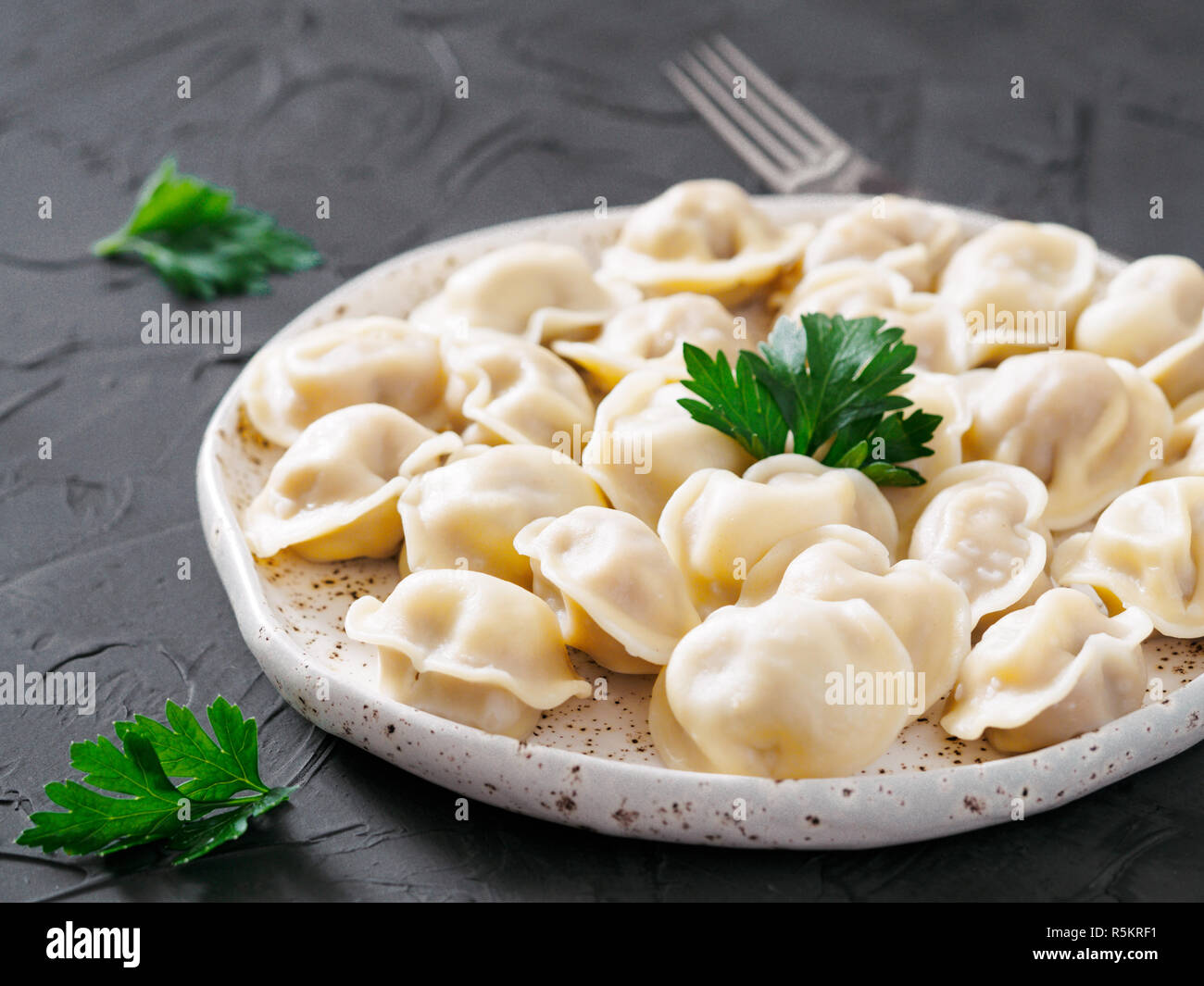 Russian pelmeni, ravioli, dumplings with meat Stock Photo - Alamy