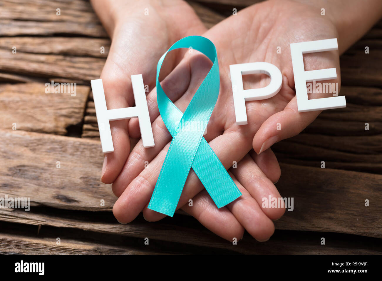 Hand Showing Ribbon With Hope Text Stock Photo Alamy