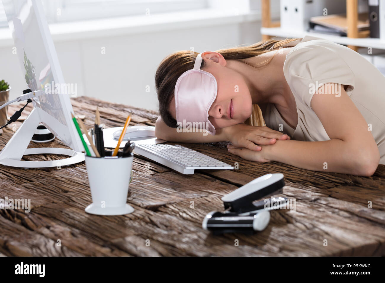 Woman Sleeping On Office Desk Stock Photo 227245296 Alamy
