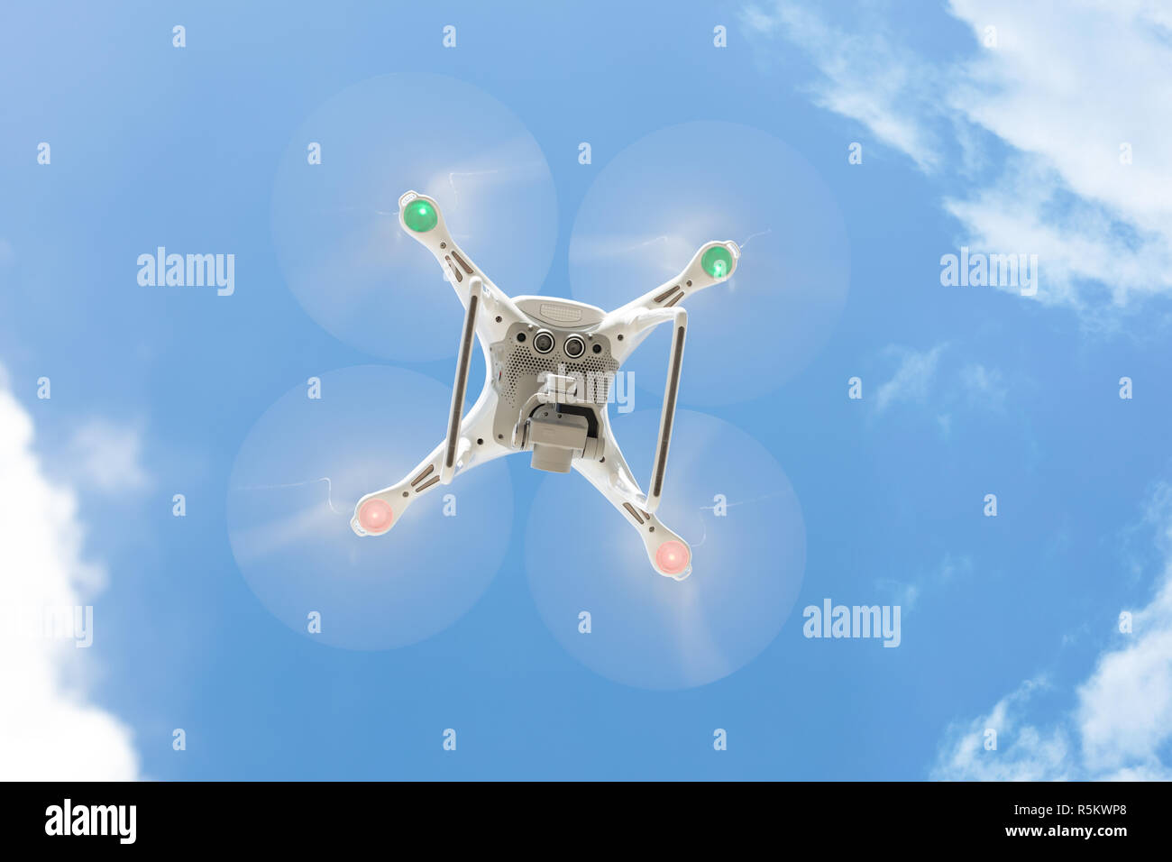 Drone flying against clear blue sky Stock Photo