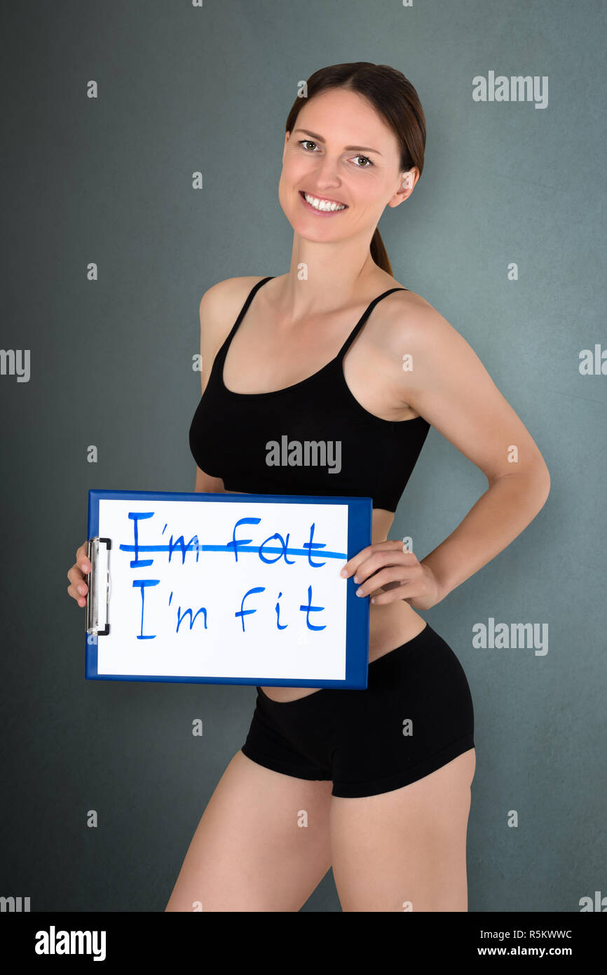 Young Woman Holding I'm Fit Text Stock Photo - Alamy