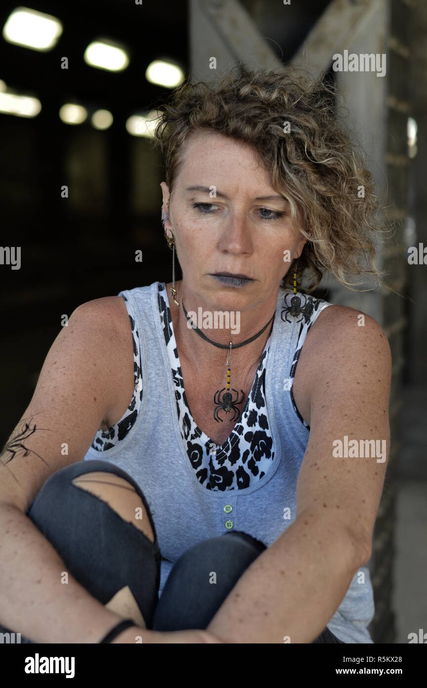 middle-aged punk stares gloomily Stock Photo