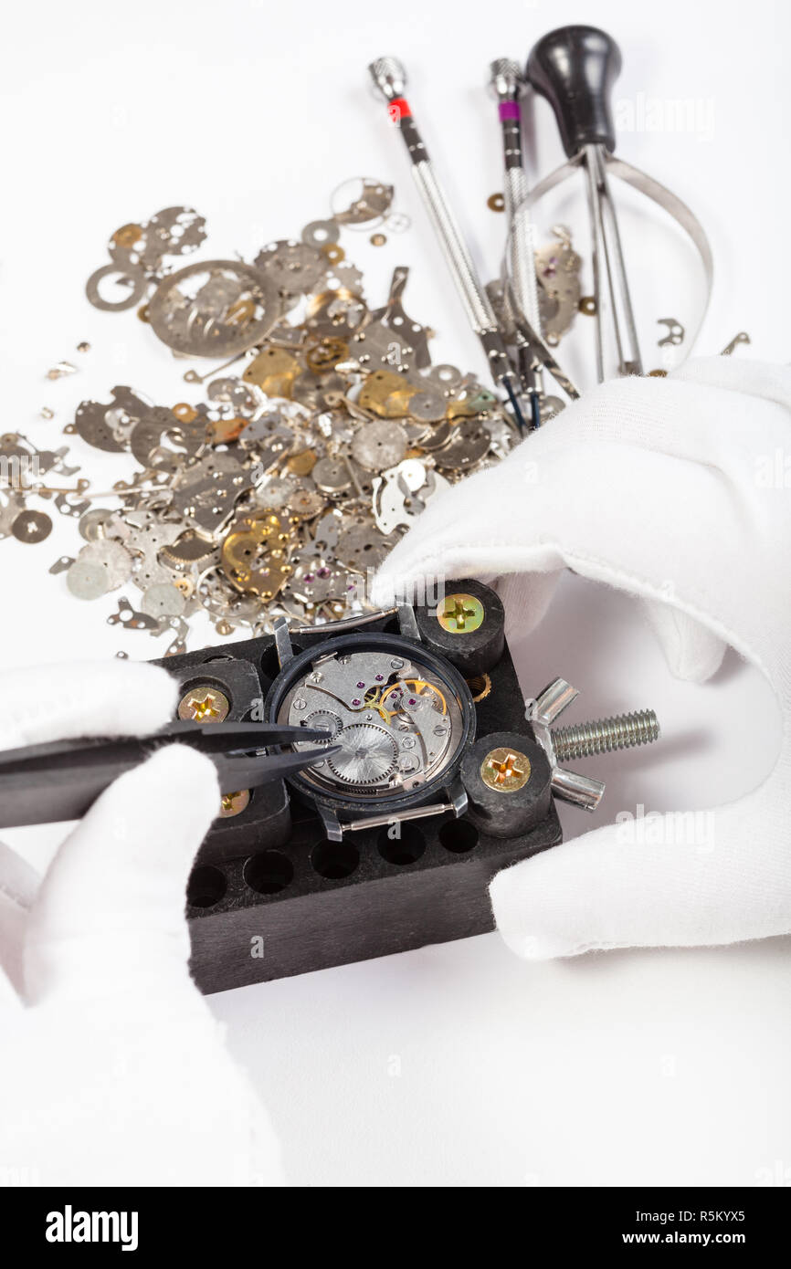 repair of mechanic watch with spare parts Stock Photo Alamy