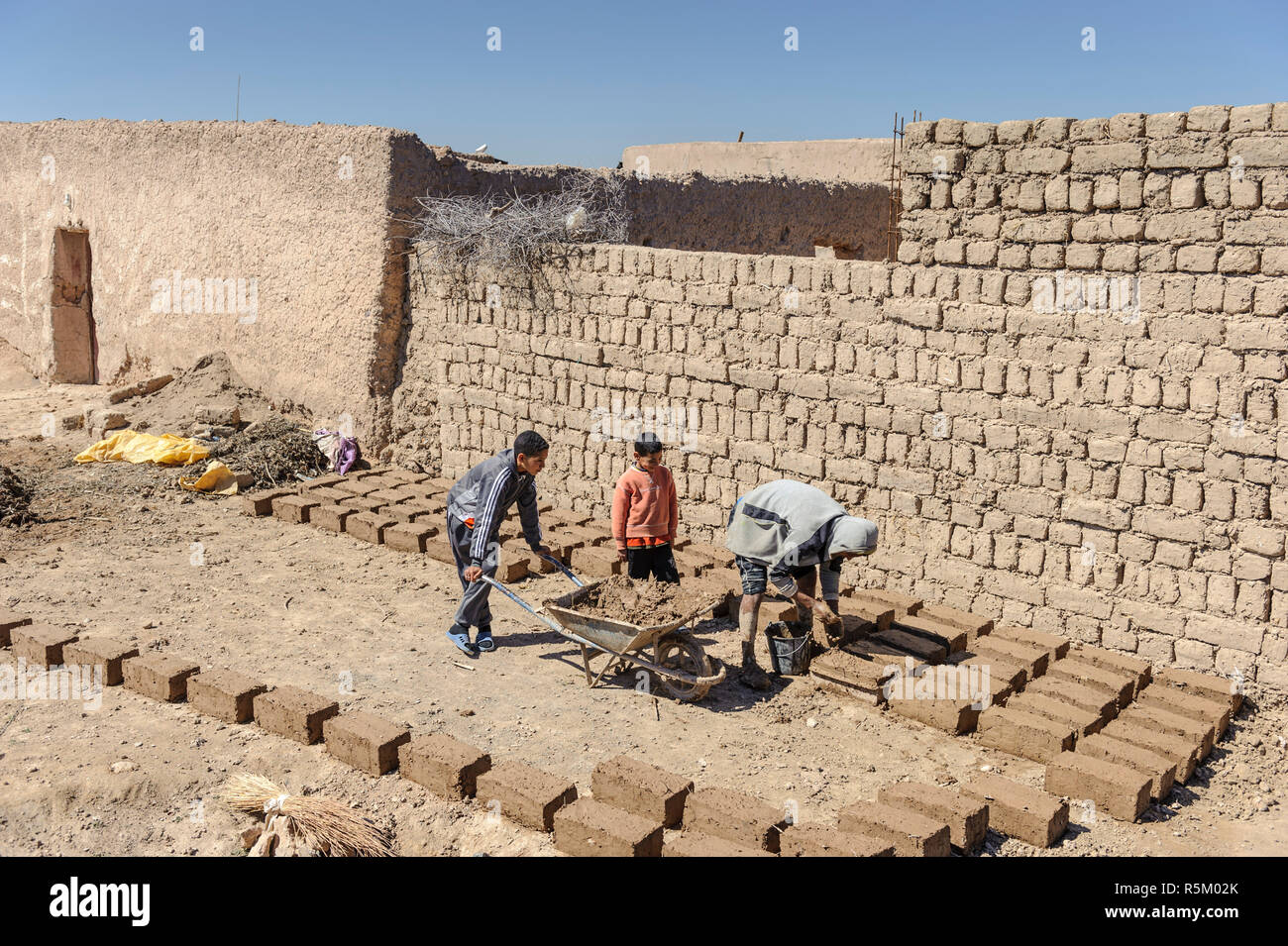 01-03-15, Marrakech, Morocco. Making bricks from mud and straw in the sub-Atlas Berber region. Bricks drying in the sun. Photo: © Simon Grosset Stock Photo