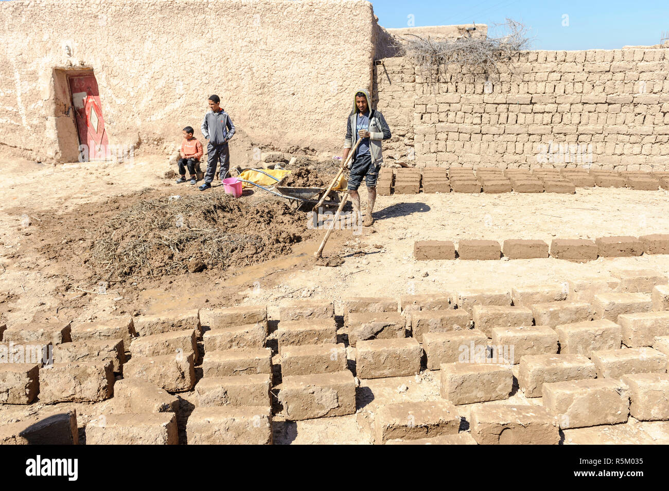 01-03-15, Marrakech, Morocco. Making bricks from mud and straw in the sub-Atlas Berber region. Bricks drying in the sun. Photo: © Simon Grosset Stock Photo