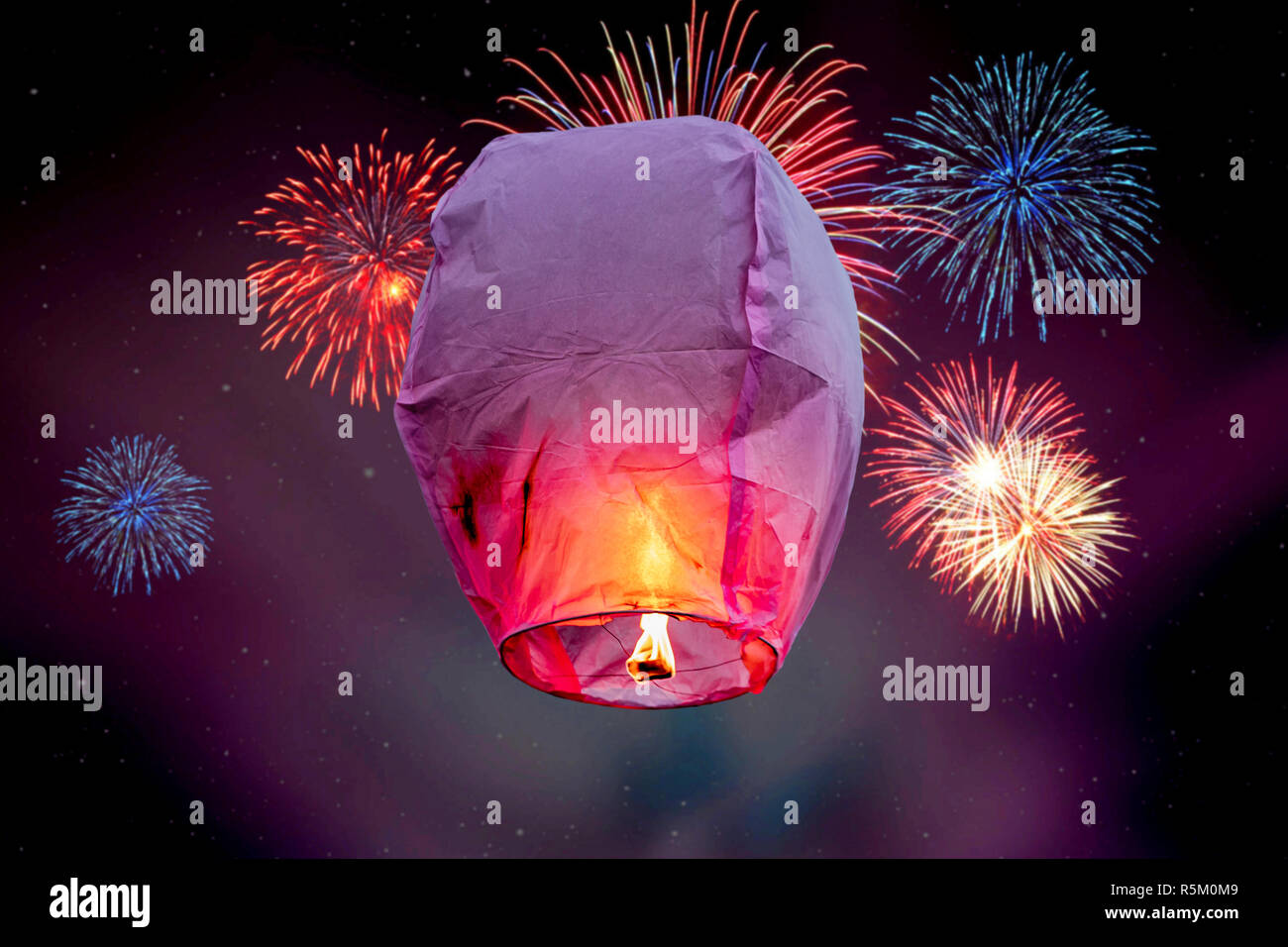 balloon fire flying lanterns, hot-air balloons Lantern flies up highly in the sky. Stock Photo