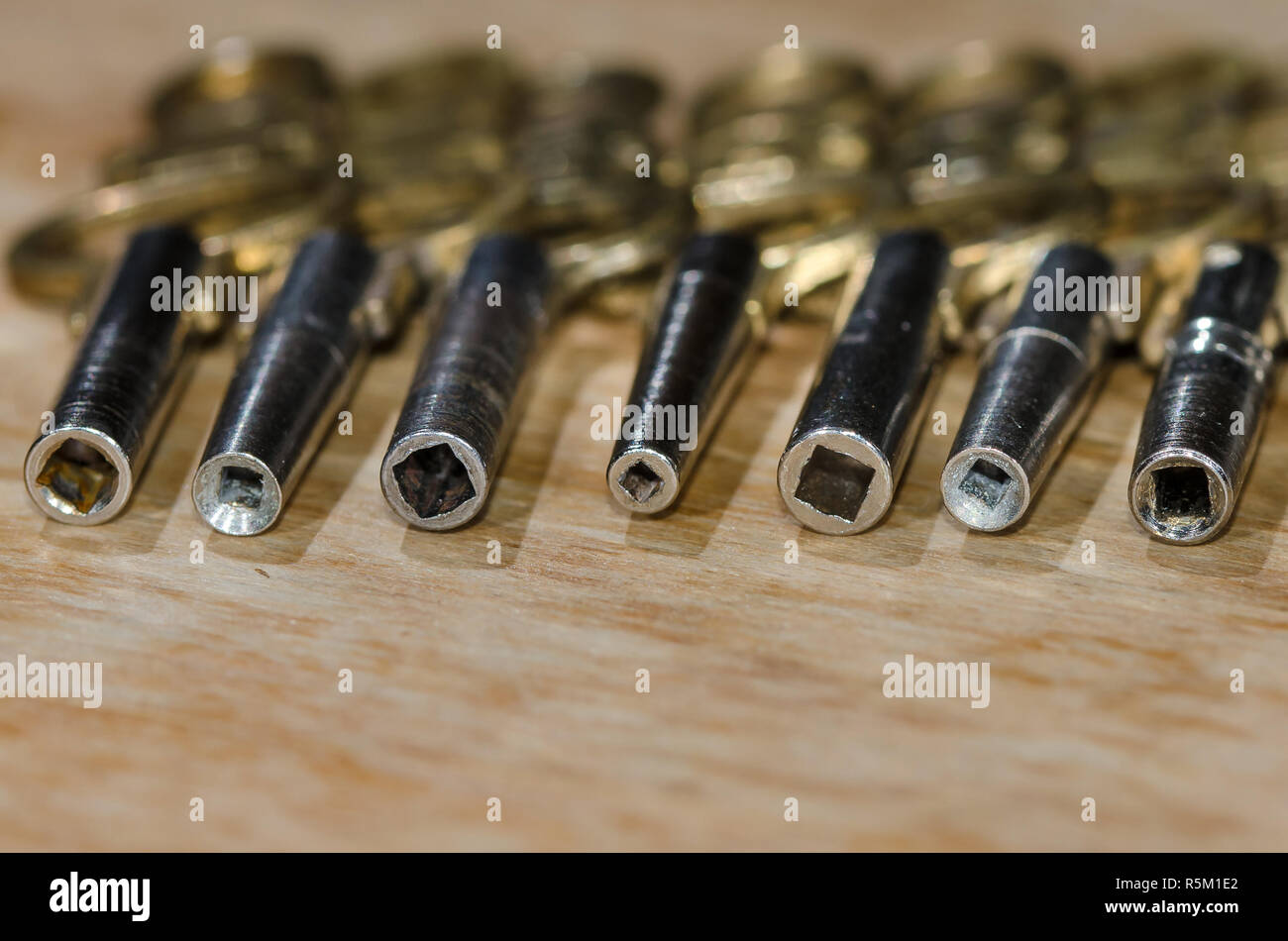 Row of Antique Pocket Watch Keys Laying on the Watchmakerâ€™s Bench