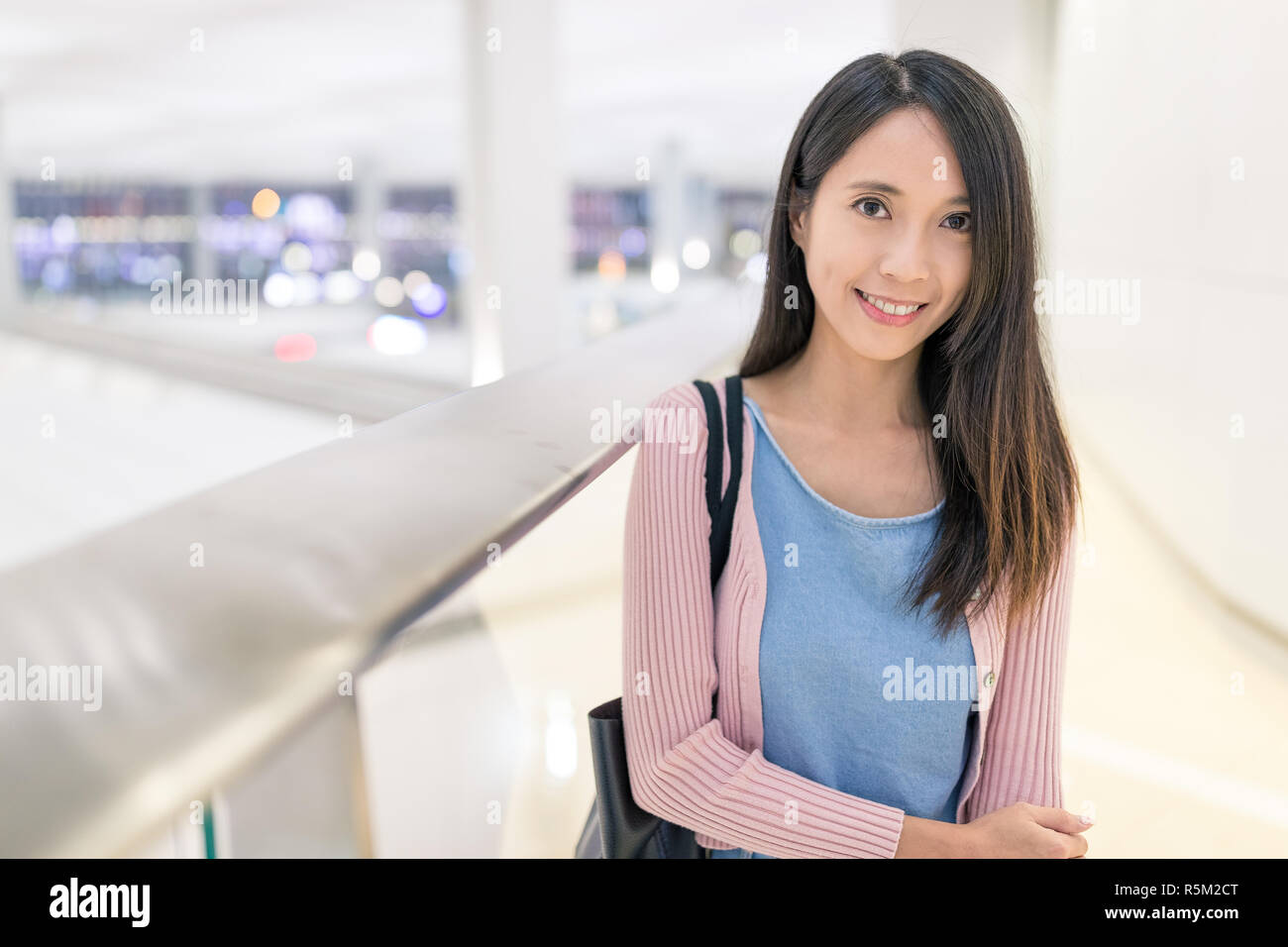 Woman in Hong Kong airport Stock Photo - Alamy