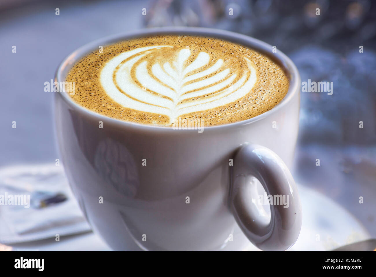 a white cup of coffee latte art Stock Photo