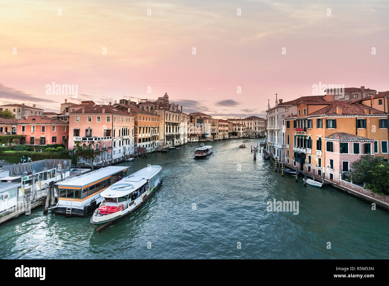 View of the Grand Canal with Vaporetto stop Venice at evening, Italy ...
