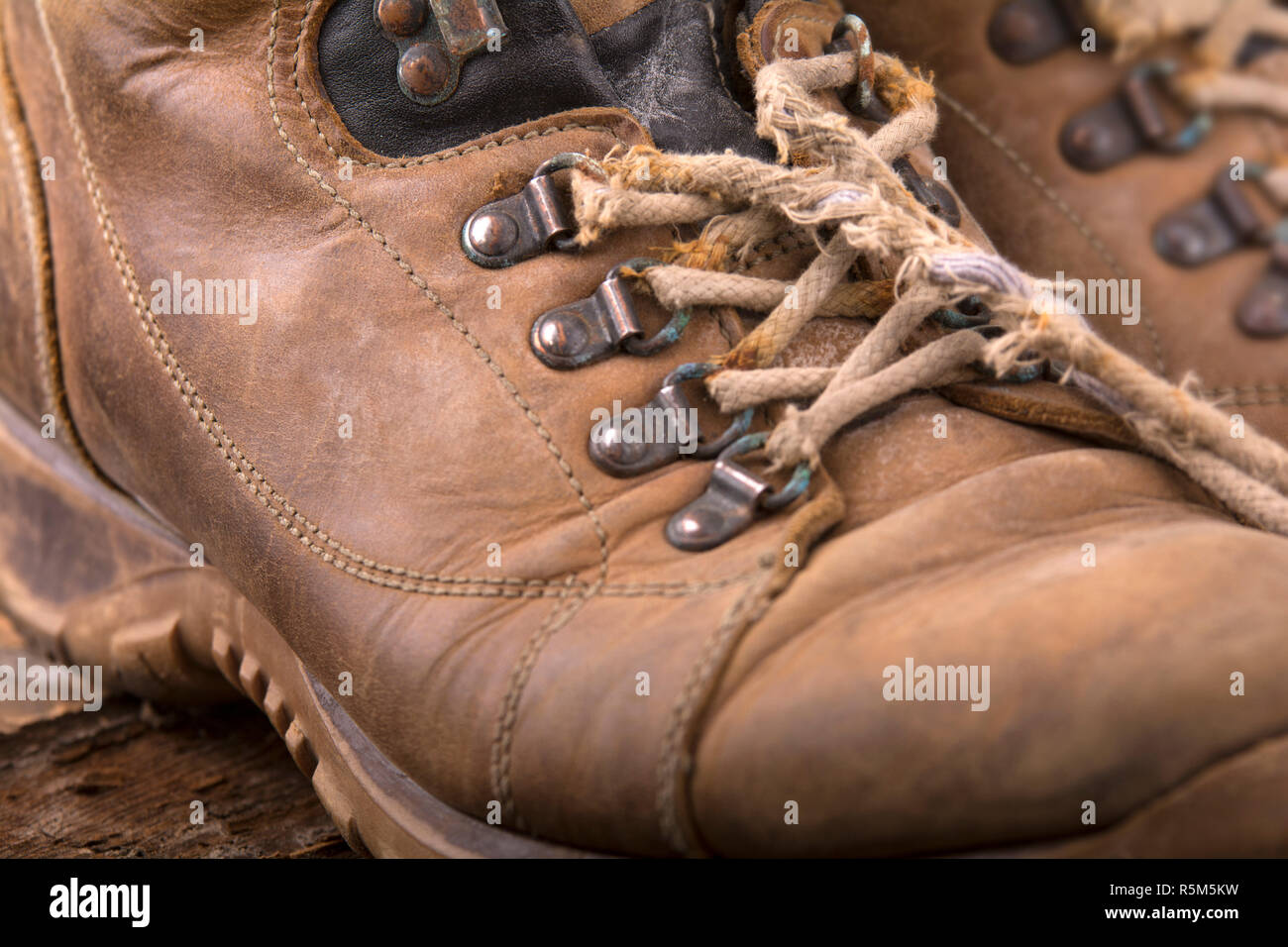 old hiking boots with broken laces Stock Photo Alamy