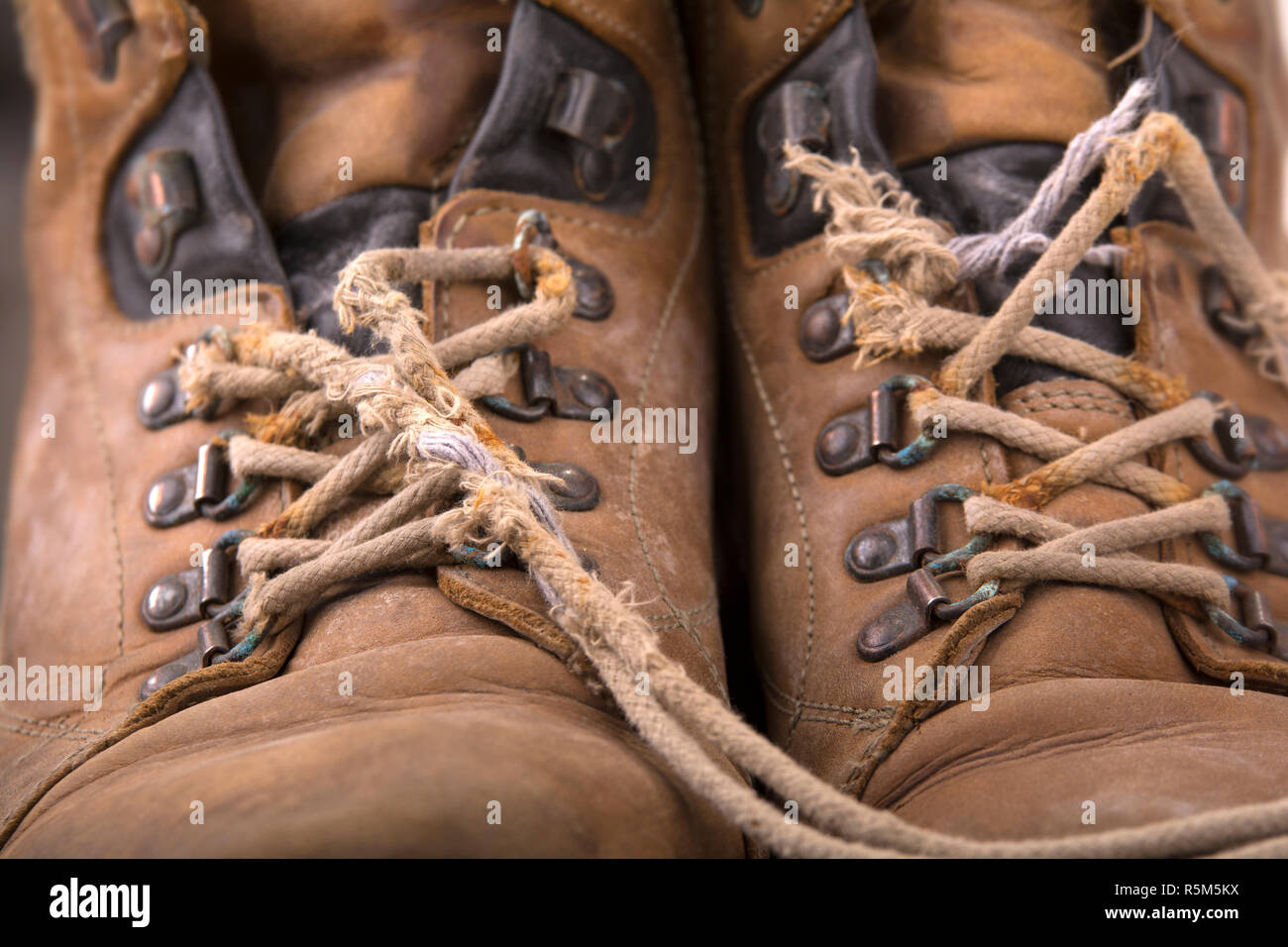 old hiking boots with broken laces Stock Photo Alamy