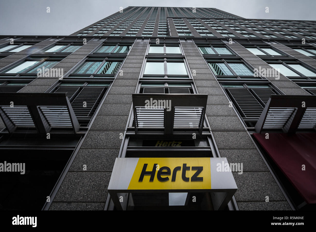 MONTREAL, CANADA - NOVEMBER 3, 2018: Logo of Hertz on their main office for Montreal, Quebec. Hertz is a car rental company from the USA spread worldw Stock Photo