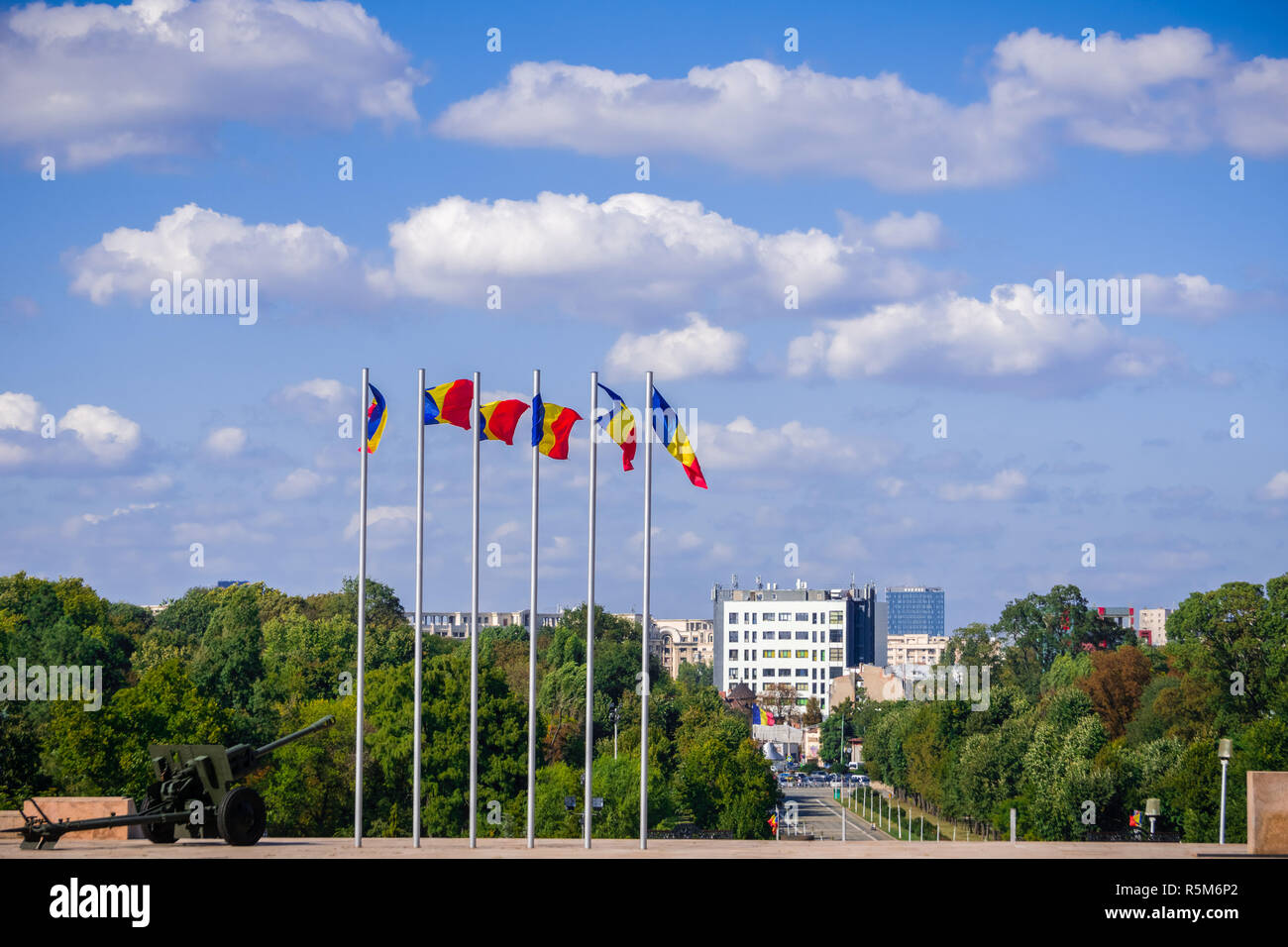 Romanian national flags waving in the wind on top of the hill in Carol Park, Bucharest, Romania Stock Photo