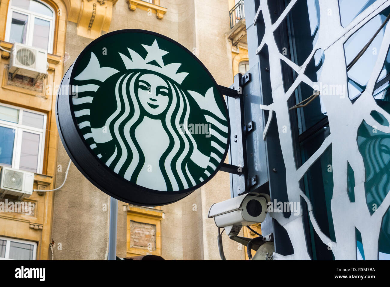 September 22, 2017 Bucharest/Romania - Starbucks logo at the entrance to a cafe located near Piata Victoriei Stock Photo