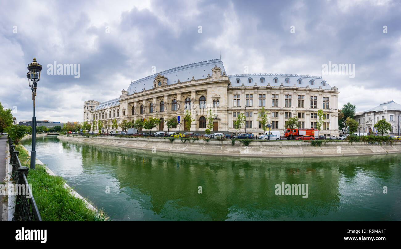 September 22, 2017 Bucharest/Romania - Panoramic view of Palace of Justice in downtown Bucharest reflected in Dambovita River; dramatic cloudy sky in  Stock Photo