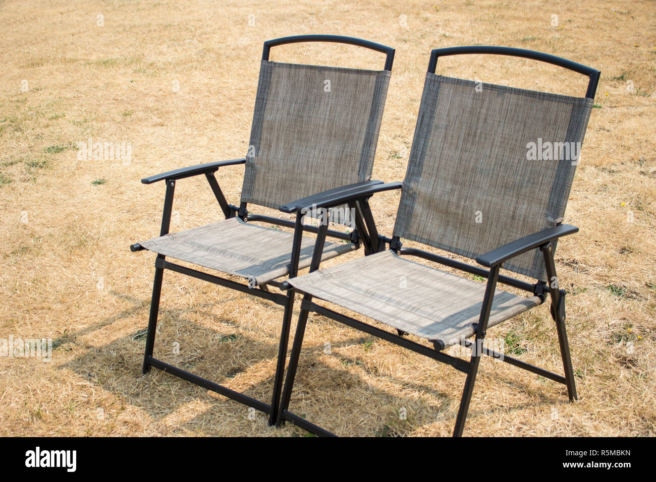Two empty folding chair on hi-res stock photography and images - Alamy